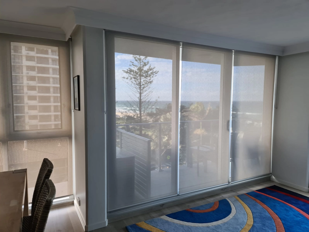 Light filtering roller blinds with ocean views