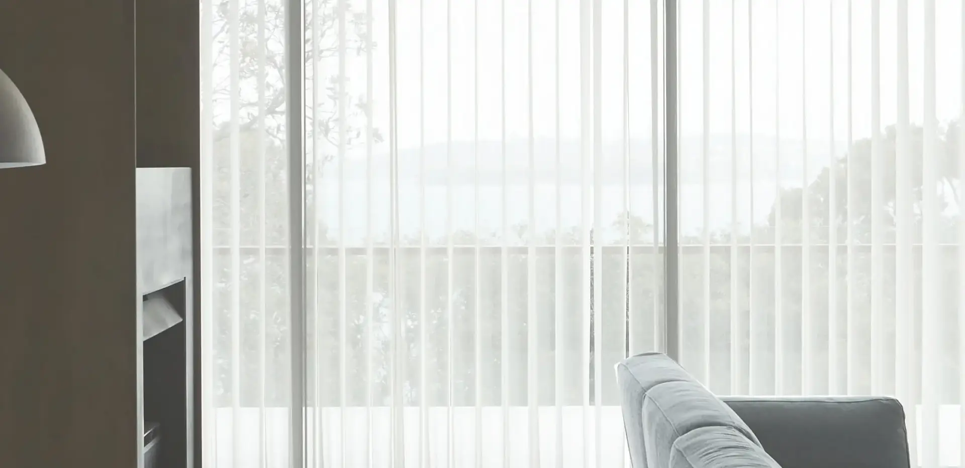 Sheer curtains filtering daylight across a bright living room