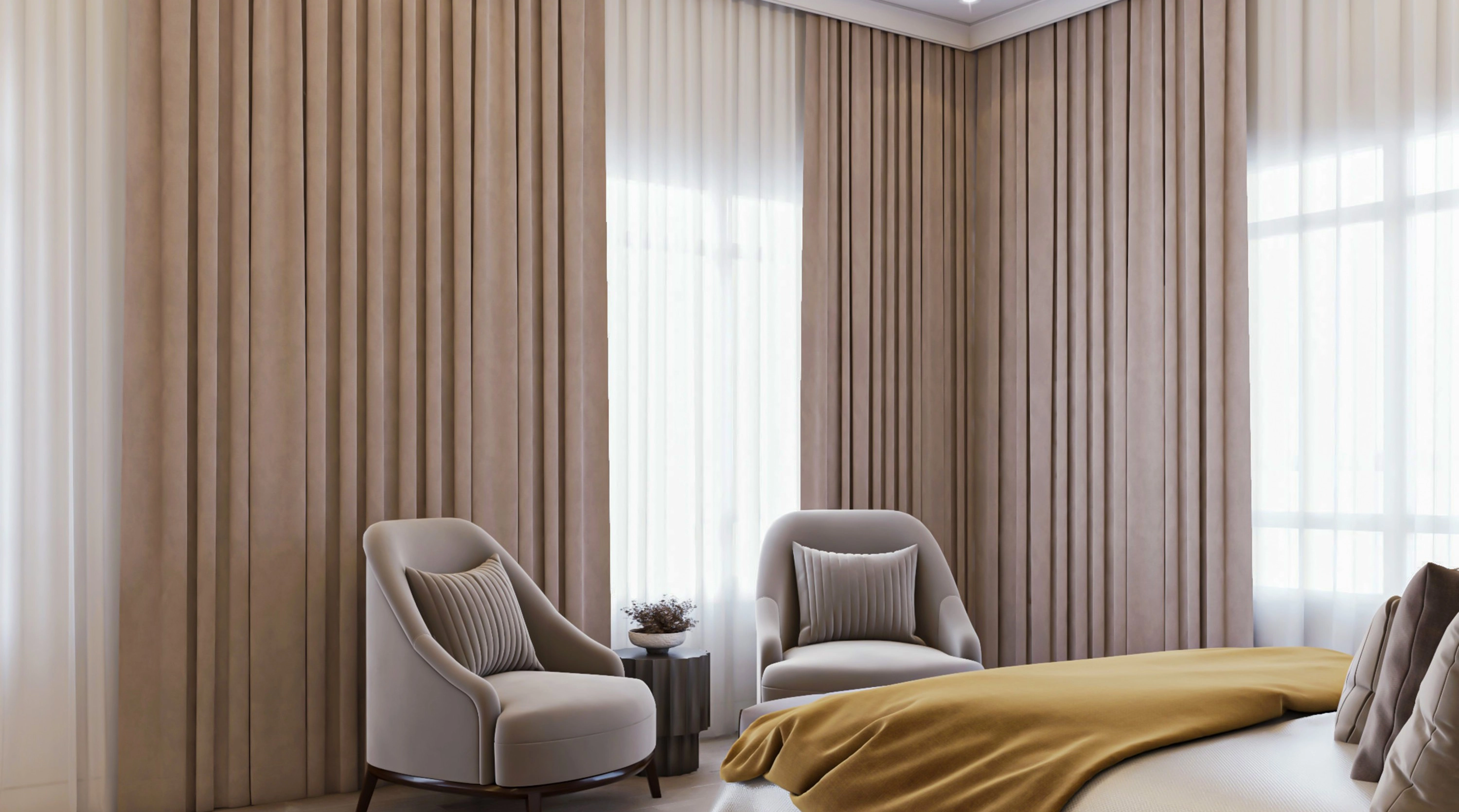 Neutral blockout curtains fitted across a bedroom with lounge chairs