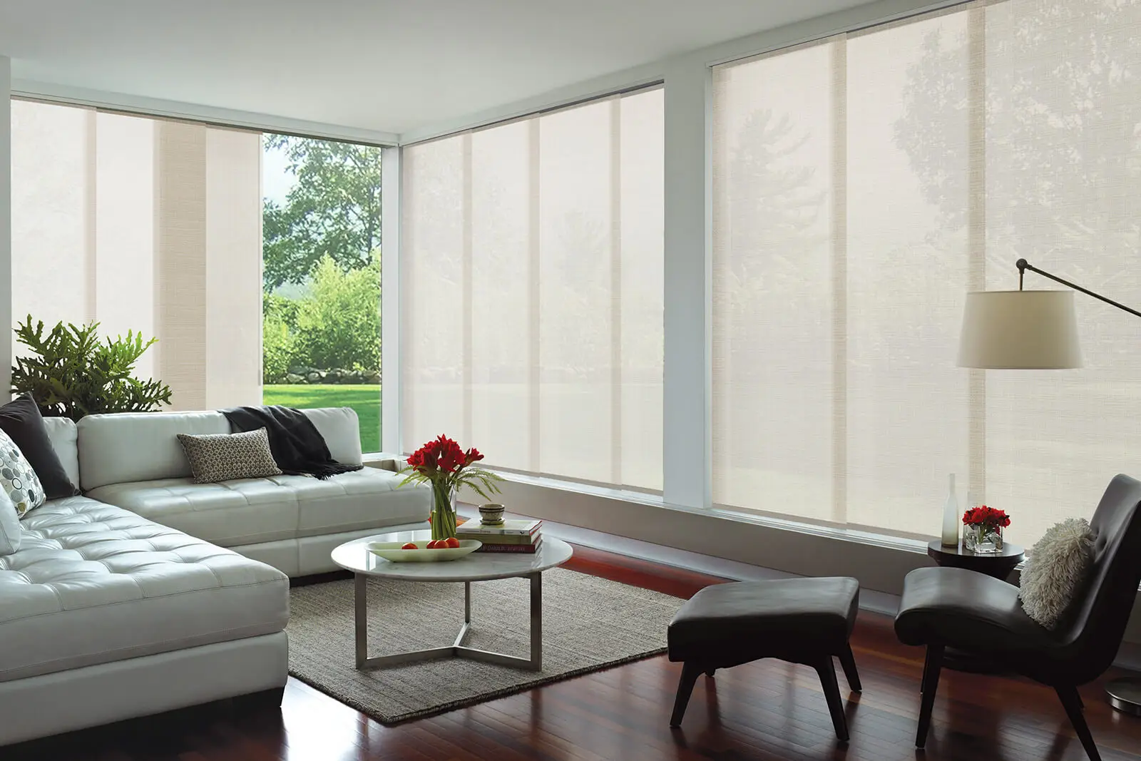 Panel glide blinds across large windows in a modern living room