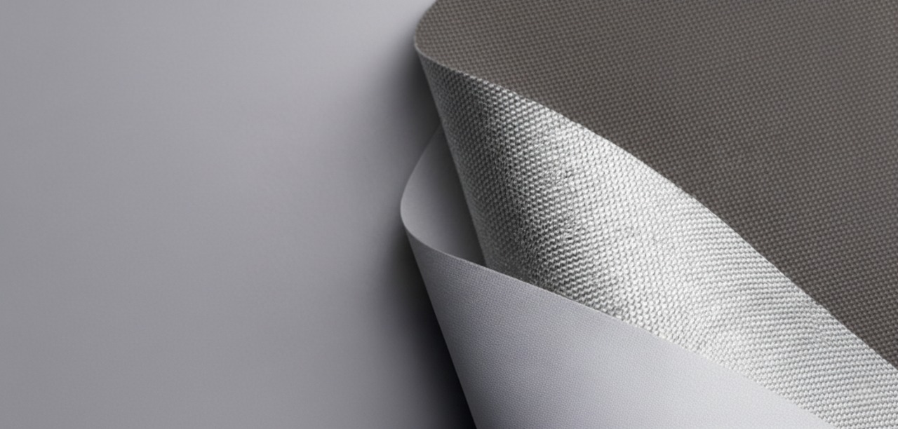 Close view of a woven roller blind fabric showing its texture and openness