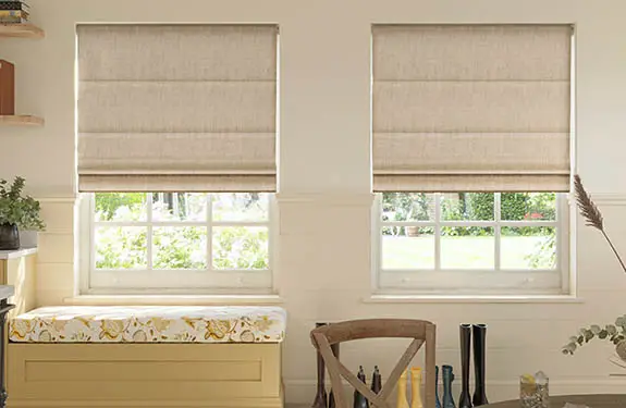 Custom Roman blinds fitted across cottage style windows